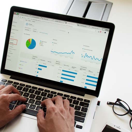 A laptop screen shoing a report dashboard.