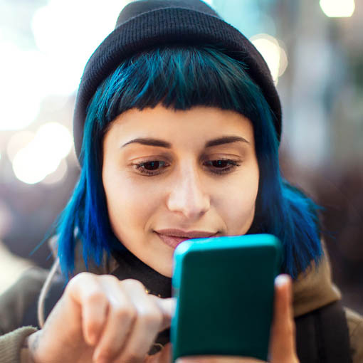 Girl applying for ticket refund via smartphone.